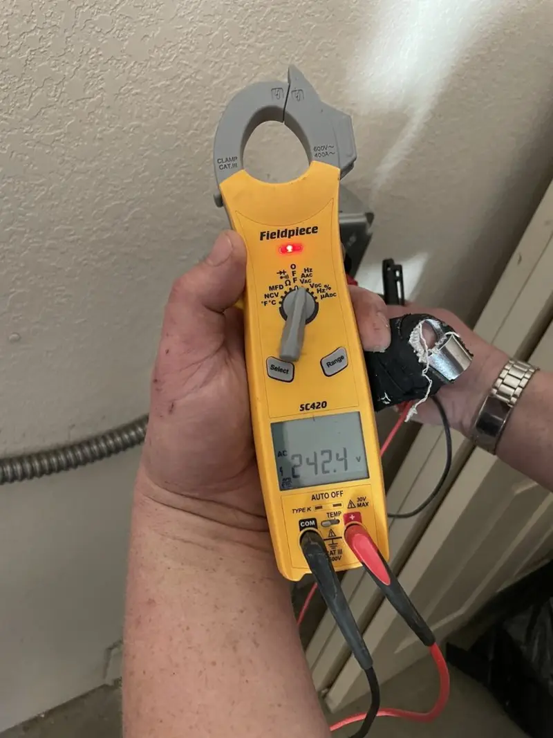 Voltage testing with clamp meter during Recessed Lighting Installation in Marcellus
